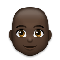 Man- Dark Skin Tone- Bald emoji on LG